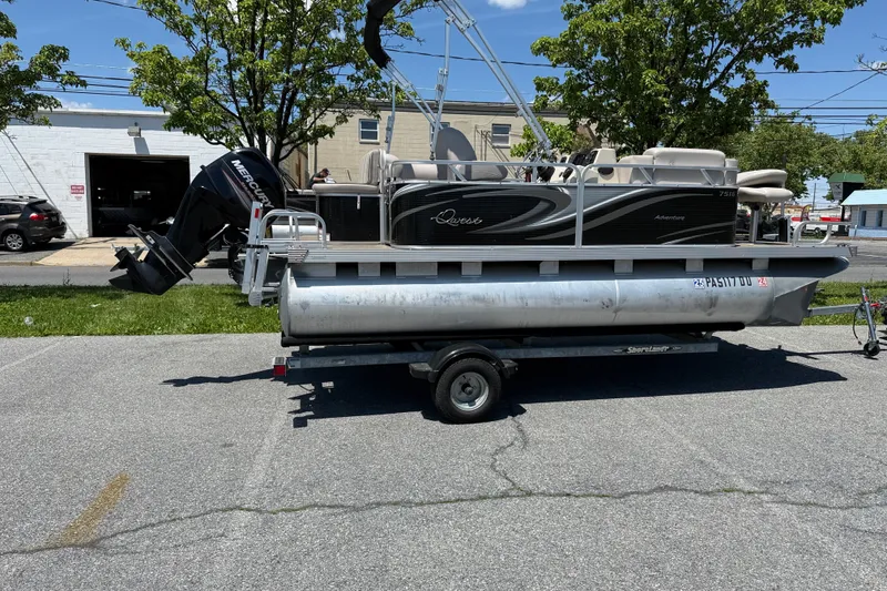 Slide: The Image of Pontoon boat Qwest 7516 SC 2018 on trailer, parked outdoors on sunny day. - 1