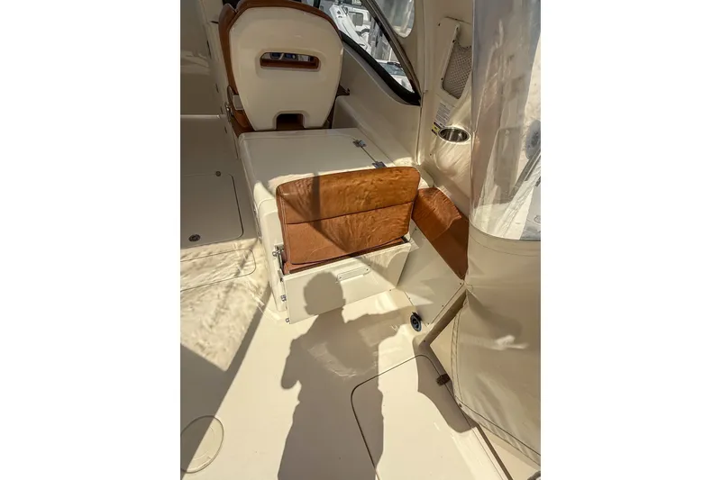 Slide: The Image of 2018 Scout 275 Dorado boat interior with tan seating and sleek design. - 17