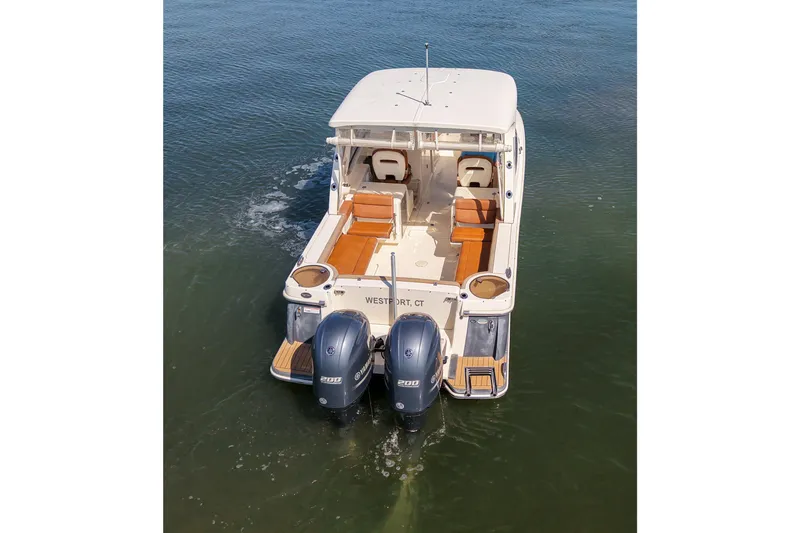 Slide: The Image of 2018 Scout 275 Dorado boat with dual engines on water. - 8