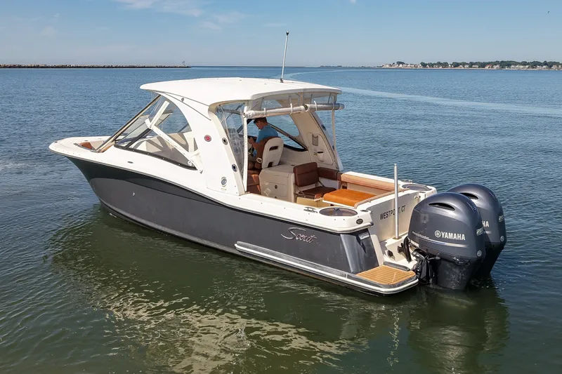 Slide: The Image of 2018 Scout 275 Dorado boat with twin Yamaha engines on calm water. - 3