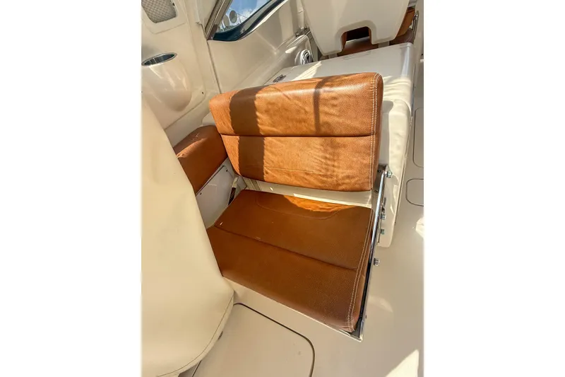 Slide: The Image of 2018 Scout 275 Dorado boat interior with brown leather seating. - 20