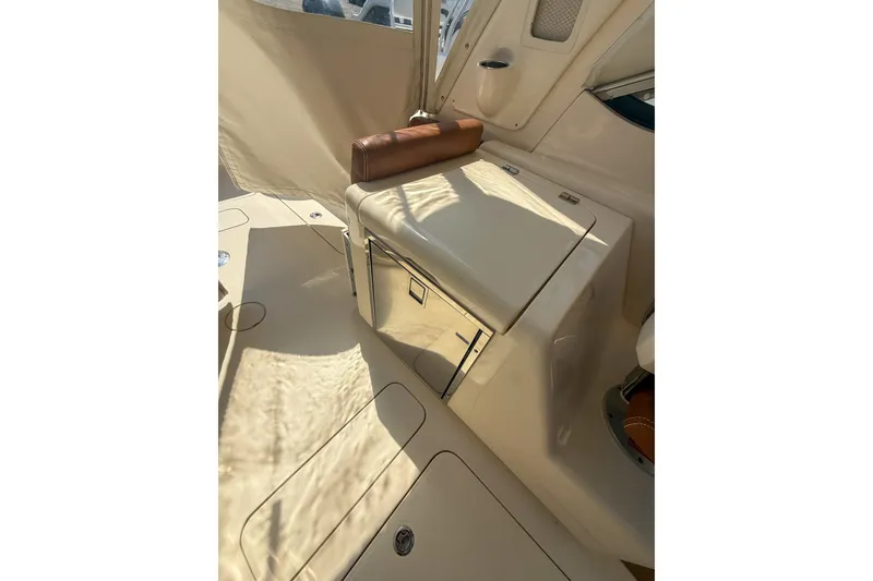 Slide: The Image of Interior view of a 2018 Scout 275 Dorado boat, featuring seating and storage. - 26