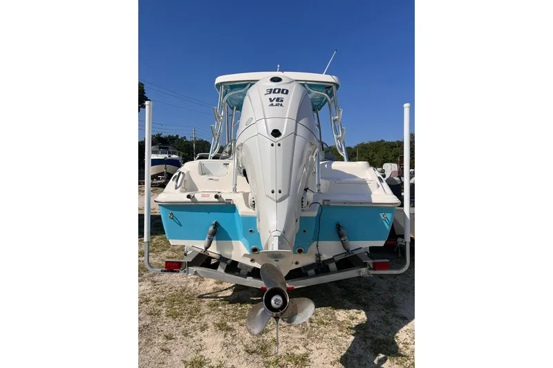 Slide: The Image of 2025 Key West 239 DFS boat with powerful 300 V6 engine, rear view. - 1