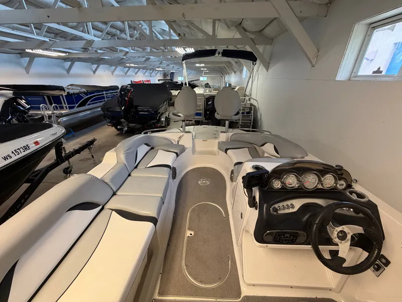 Slide: The Image of The image shows the cockpit of a 2015 Starcraft 220 STARSTEP in a storage facility. - 29