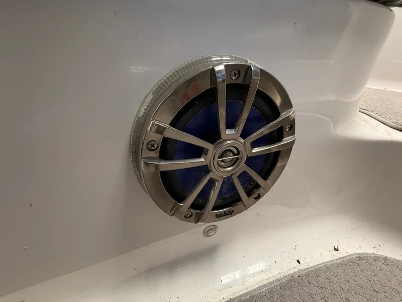 Slide: The Image of A speaker is mounted in the white wall of a boat. - 21