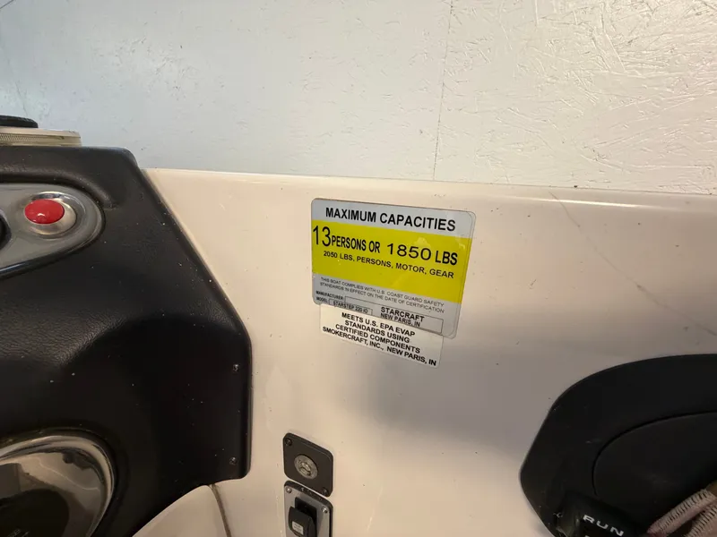 Slide: The Image of A sign shows the maximum capacity of 13 persons or 1850 pounds for the boat. - 39