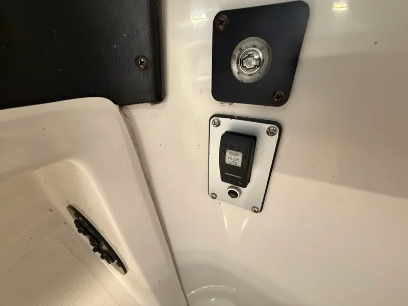 Slide: The Image of Close-up of a switch and outlet on a boat's interior panel. - 22