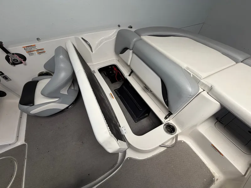 Slide: The Image of Interior view of a 2015 Starcraft 220 STARSTEP with gray and white seating. - 15