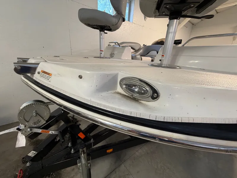 Slide: The Image of A 2015 Starcraft 220 STARSTEP boat on a trailer in a garage. - 7