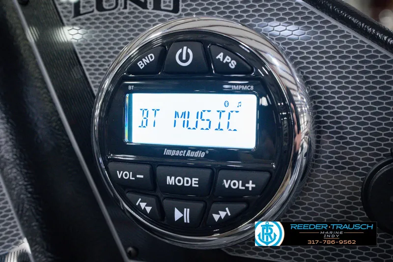 Slide: The Image of Close-up of a 2026 Lund 1800 Explorer SS audio system displaying "BT MUSIC". - 42