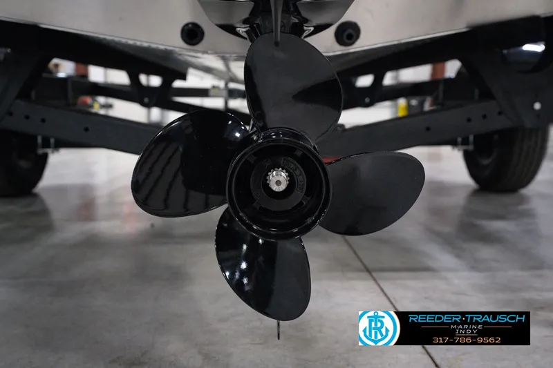 Slide: The Image of Close-up of a 2026 Lund 1800 Explorer SS boat propeller in a showroom. - 54