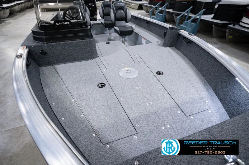 Slide: The Image of 2026 Lund 1800 Explorer SS boat interior with spacious deck and seating. - 13