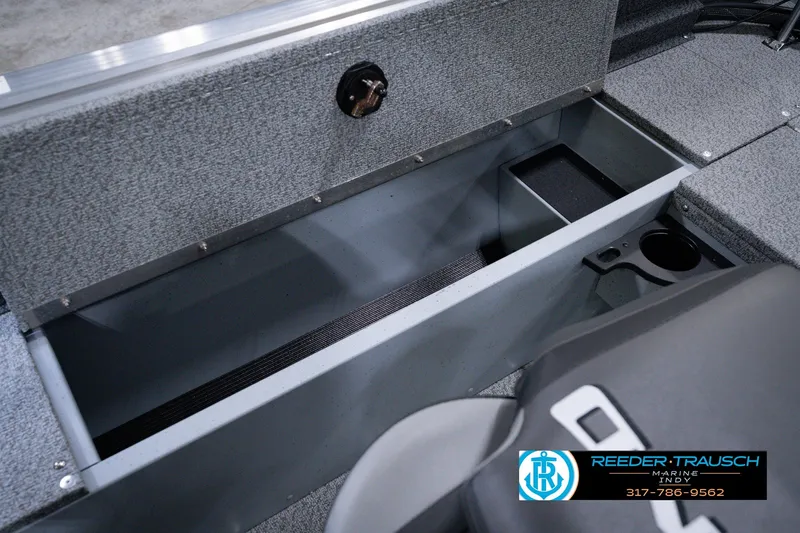 Slide: The Image of Interior storage compartment of 2026 Lund 1800 Explorer SS boat, featuring durable construction. - 29