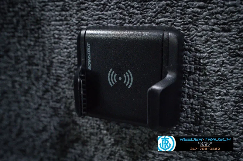 Slide: The Image of Close-up of a Scanstrut wireless charging mount on a 2026 Lund 1800 Explorer SS boat. - 43