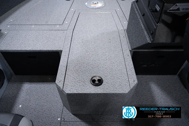 Slide: The Image of Interior of 2026 Lund 1800 Explorer SS boat, featuring storage compartments and carpeted flooring. - 30