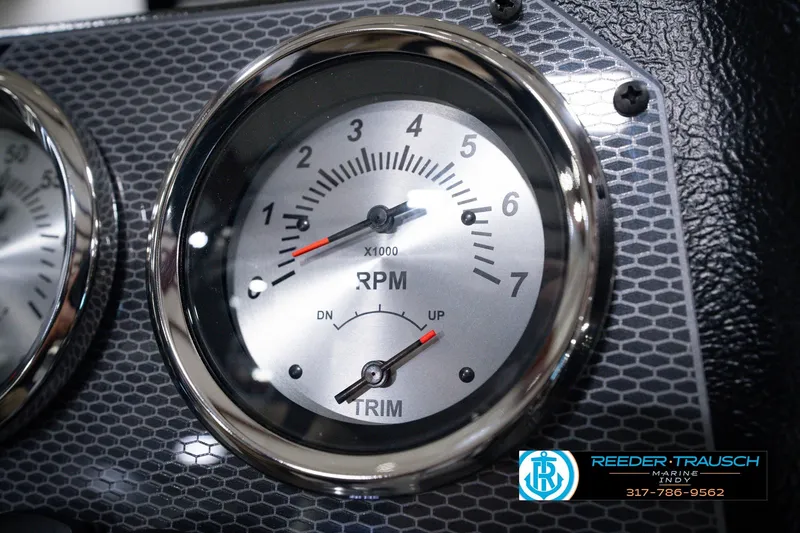 Slide: The Image of Close-up of RPM gauge on 2026 Lund 1800 Explorer SS boat dashboard. - 39