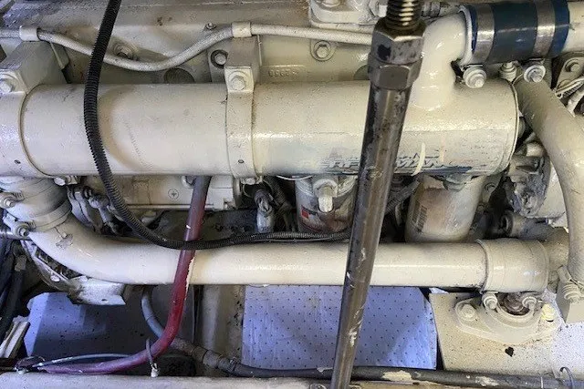 Slide: The Image of Engine compartment of a 2000 Carver 406 Aft Cabin Motor Yacht, showcasing mechanical components. - 48