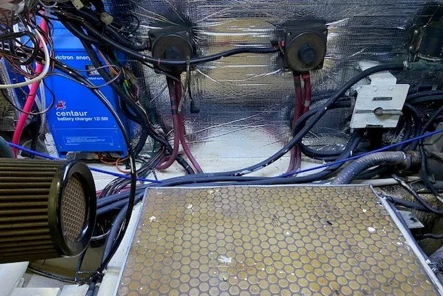 Slide: The Image of Engine room of 2000 Carver 406 Aft Cabin Motor Yacht with wiring and battery charger. - 45