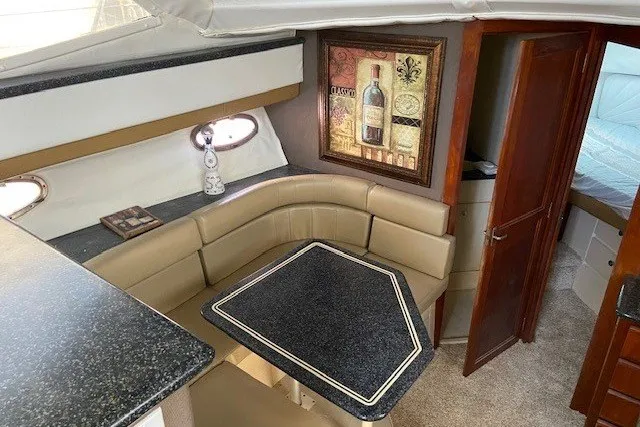 Slide: The Image of Interior of 2000 Carver 406 Aft Cabin Motor Yacht with cozy seating and elegant decor. - 23