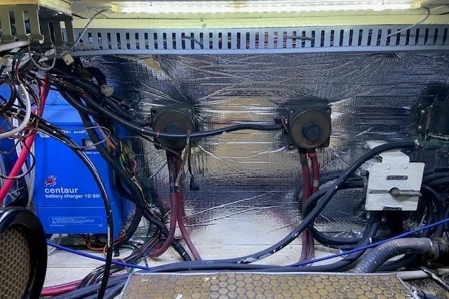 Slide: The Image of Engine room of 2000 Carver 406 Aft Cabin Motor Yacht with wiring and battery charger. - 51