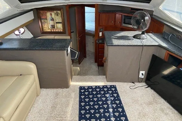 Slide: The Image of Interior of 2000 Carver 406 Aft Cabin Motor Yacht with modern amenities. - 17