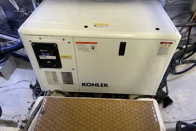 Slide: The Image of Kohler generator in a 2000 Carver 406 Aft Cabin Motor Yacht engine room. - 46