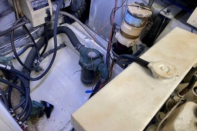 Slide: The Image of Engine room of 2000 Carver 406 Aft Cabin Motor Yacht with visible mechanical components. - 44