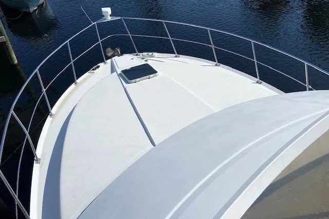 Slide: The Image of 2000 Carver 406 Aft Cabin Motor Yacht bow view on water. - 16