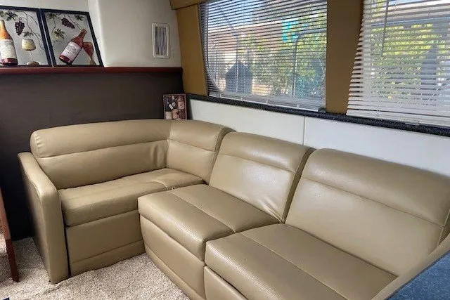 Slide: The Image of Luxurious beige leather seating in 2000 Carver 406 Aft Cabin Motor Yacht interior. - 19