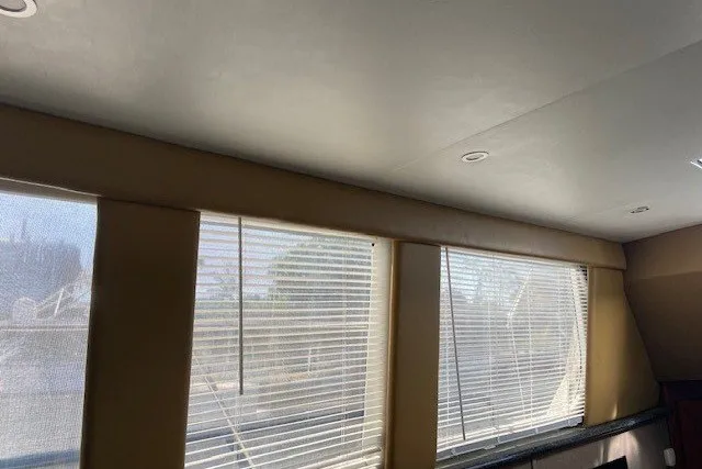 Slide: The Image of Interior view of 2000 Carver 406 Aft Cabin Motor Yacht with window blinds. - 21