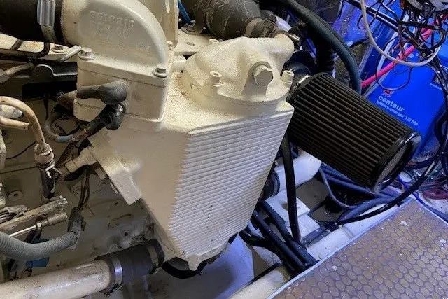 Slide: The Image of Engine compartment of 2000 Carver 406 Aft Cabin Motor Yacht with visible components. - 50