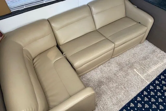 Slide: The Image of Beige leather sofa in 2000 Carver 406 Aft Cabin Motor Yacht interior. - 18