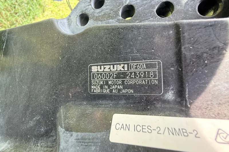 Slide: The Image of Suzuki DF60A engine label on 2023 Highfield Sport 420, made in Japan. - 12