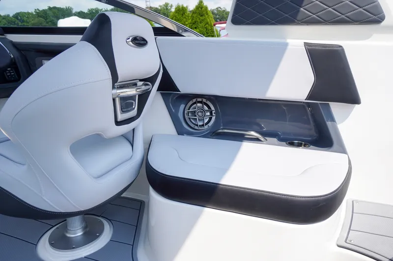 Slide: The Image of 2027 Chaparral 270 OSX boat interior with sleek seating and modern speaker system. - 49