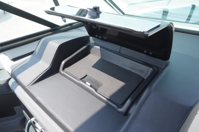 Slide: The Image of Dashboard storage compartment in the 2027 Chaparral 270 OSX boat. - 20