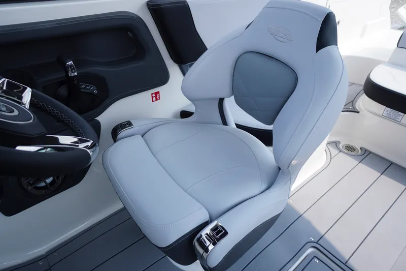 Slide: The Image of Luxury helm seat in 2027 Chaparral 270 OSX boat, featuring sleek design and premium materials. - 32