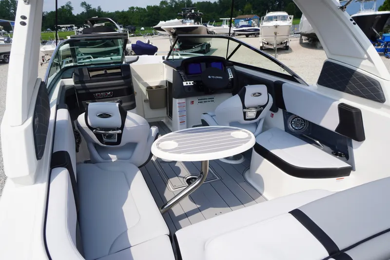 Slide: The Image of Luxurious interior of 2027 Chaparral 270 OSX boat with modern seating and table. - 38