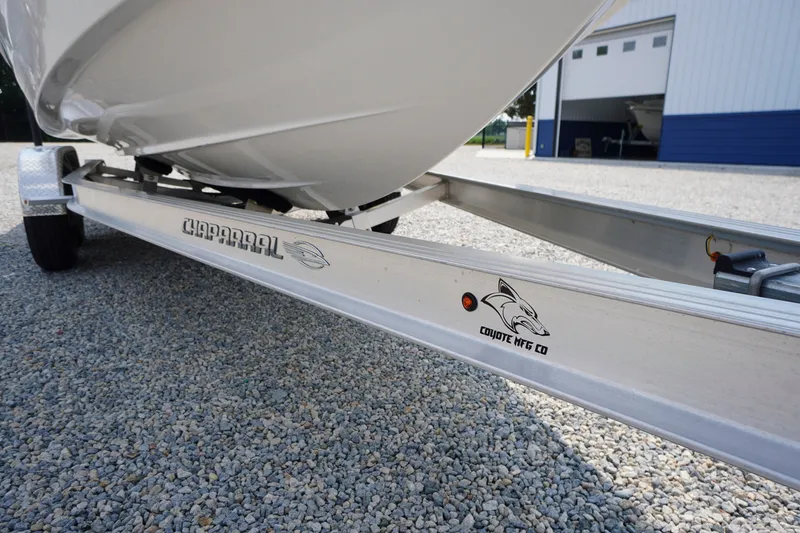 Slide: The Image of Chaparral 270 OSX 2027 boat on Coyote trailer, parked on gravel. - 69