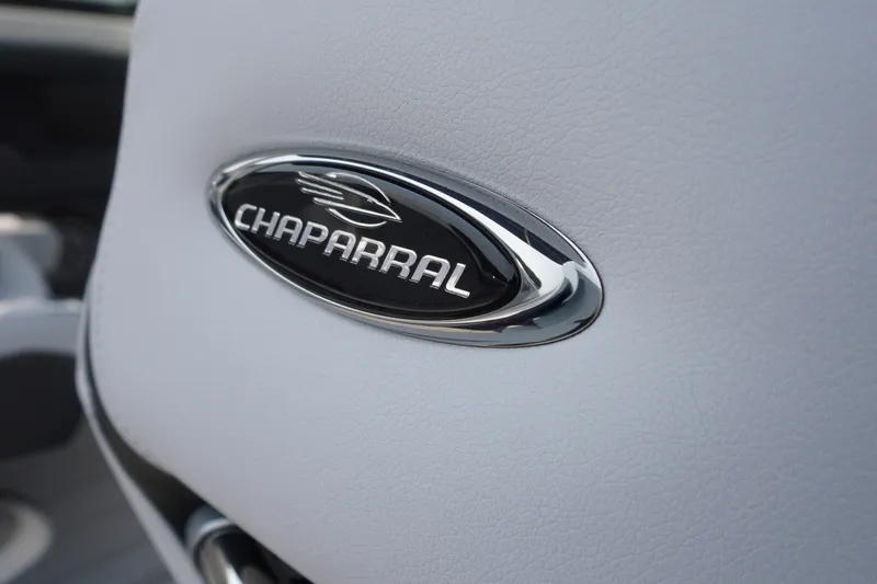 Slide: The Image of Close-up of Chaparral 270 OSX 2027 logo on white leather surface. - 36