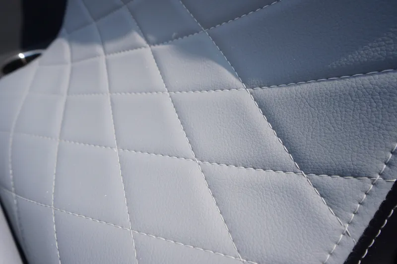 Slide: The Image of Quilted leather upholstery detail in 2027 Chaparral 270 OSX boat interior. - 10