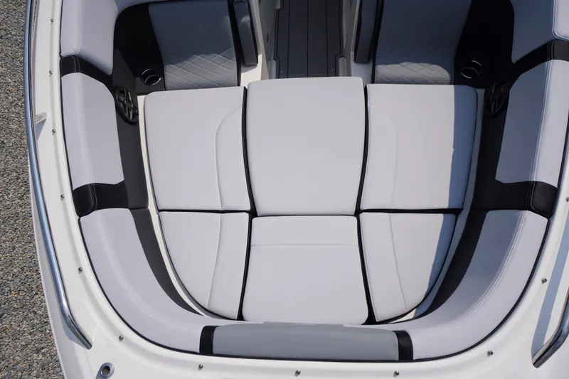 Slide: The Image of 2027 Chaparral 270 OSX boat interior with sleek, cushioned seating design. - 9