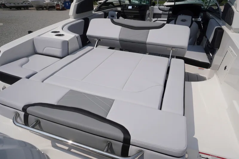 Slide: The Image of 2027 Chaparral 270 OSX boat interior with convertible seating and modern design. - 54