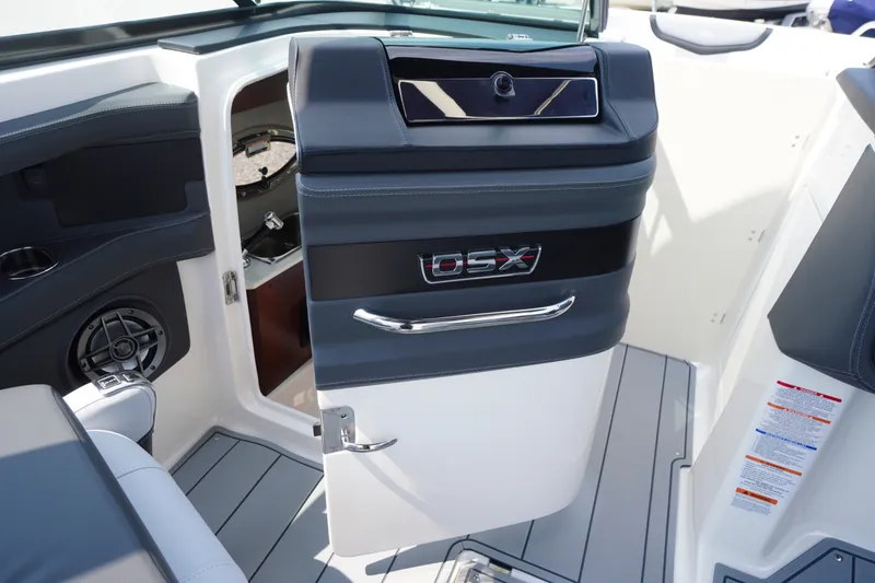 Slide: The Image of Interior view of 2027 Chaparral 270 OSX boat, featuring sleek design and modern controls. - 21