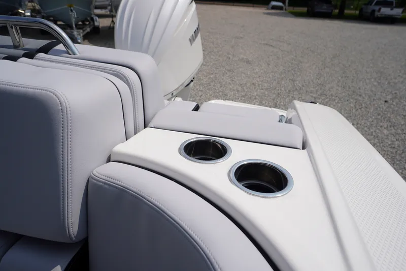 Slide: The Image of Luxury seating and cup holders on the 2027 Chaparral 270 OSX boat. - 57