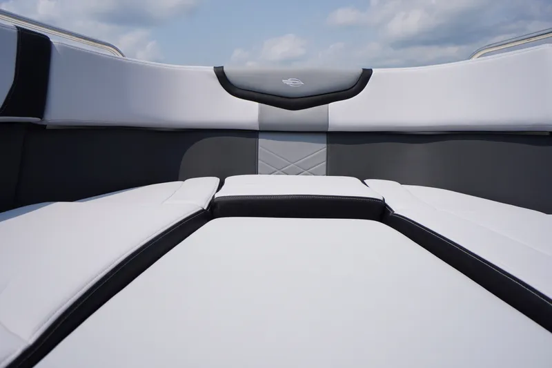 Slide: The Image of 2027 Chaparral 270 OSX boat interior with sleek white and gray seating. - 5