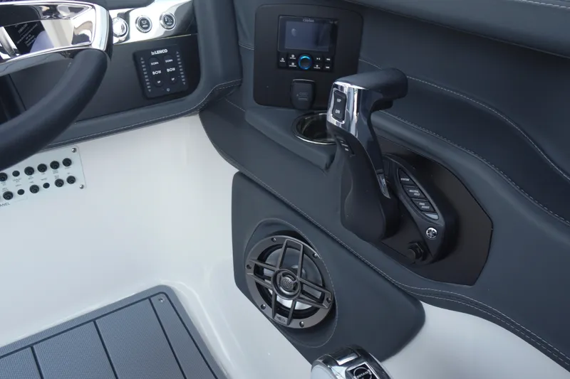 Slide: The Image of Control panel of 2027 Chaparral 270 OSX boat with steering wheel and audio system. - 31