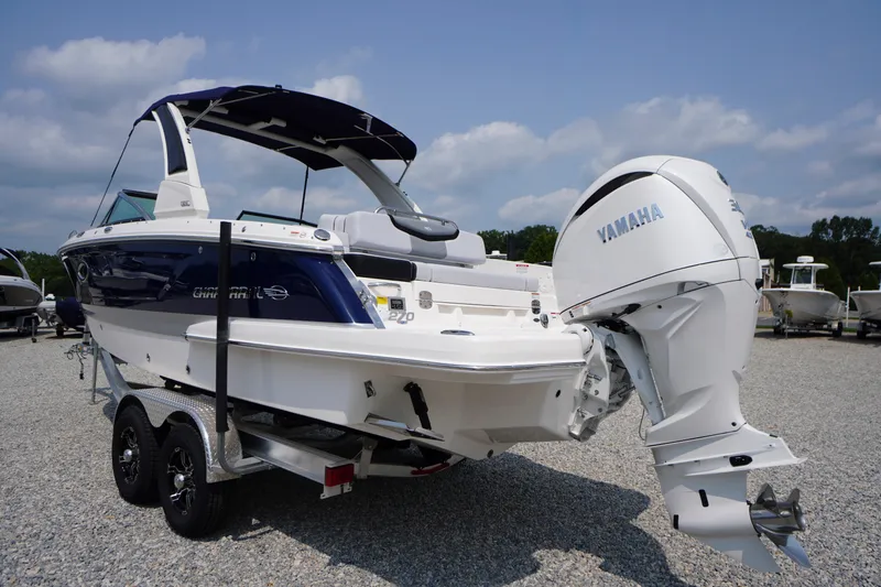 Slide: The Image of 2027 Chaparral 270 OSX boat with Yamaha engine on trailer, parked outdoors. - 71