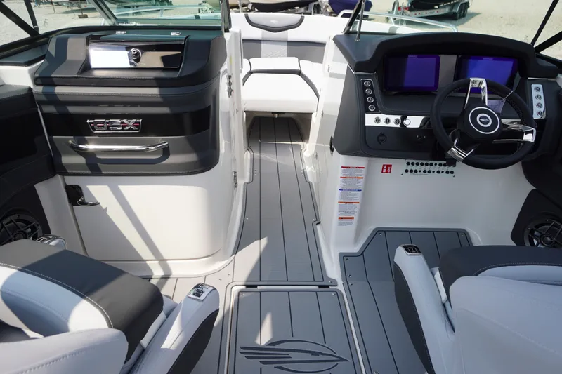 Slide: The Image of Interior view of 2027 Chaparral 270 OSX boat, featuring modern dashboard and seating. - 14