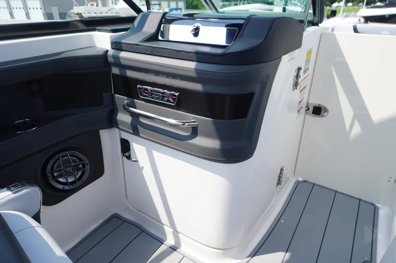 Slide: The Image of Interior view of 2027 Chaparral 270 OSX boat, featuring sleek design and modern controls. - 17