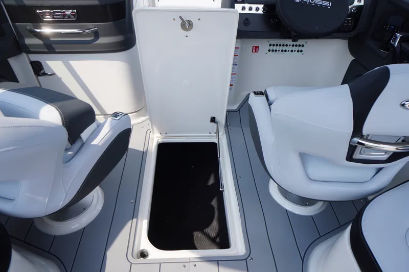 Slide: The Image of Interior of 2027 Chaparral 270 OSX boat with open storage compartment. - 44